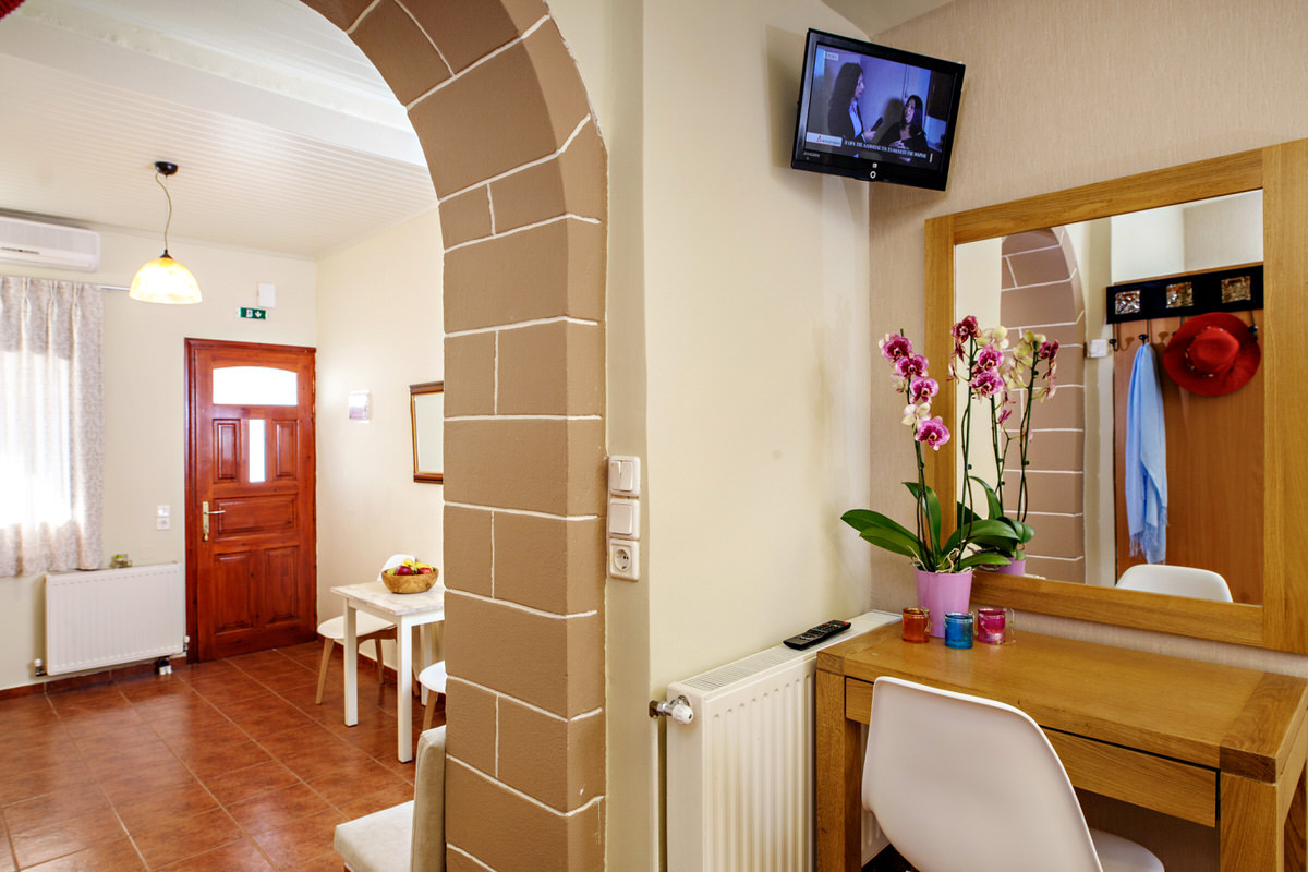A bedroom corner and view to the kitchen