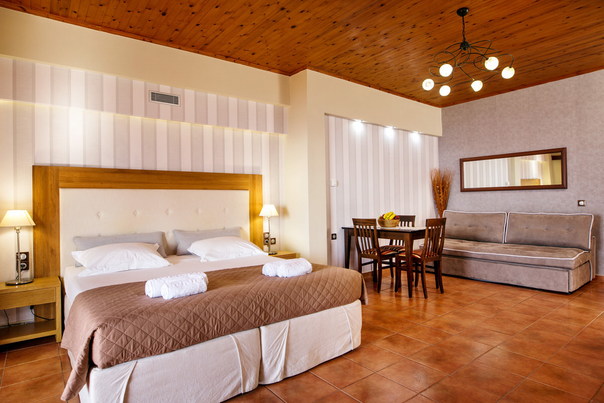 The luxurious bedroom with the kind size COCO-MAT bed and the sitting area