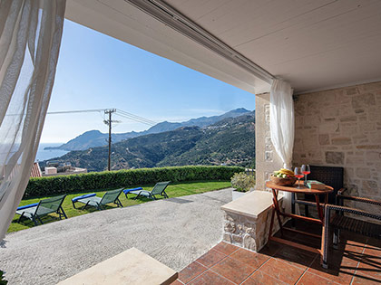 Beautiful sea view from the stone balcony of a Deluxe garden apartment